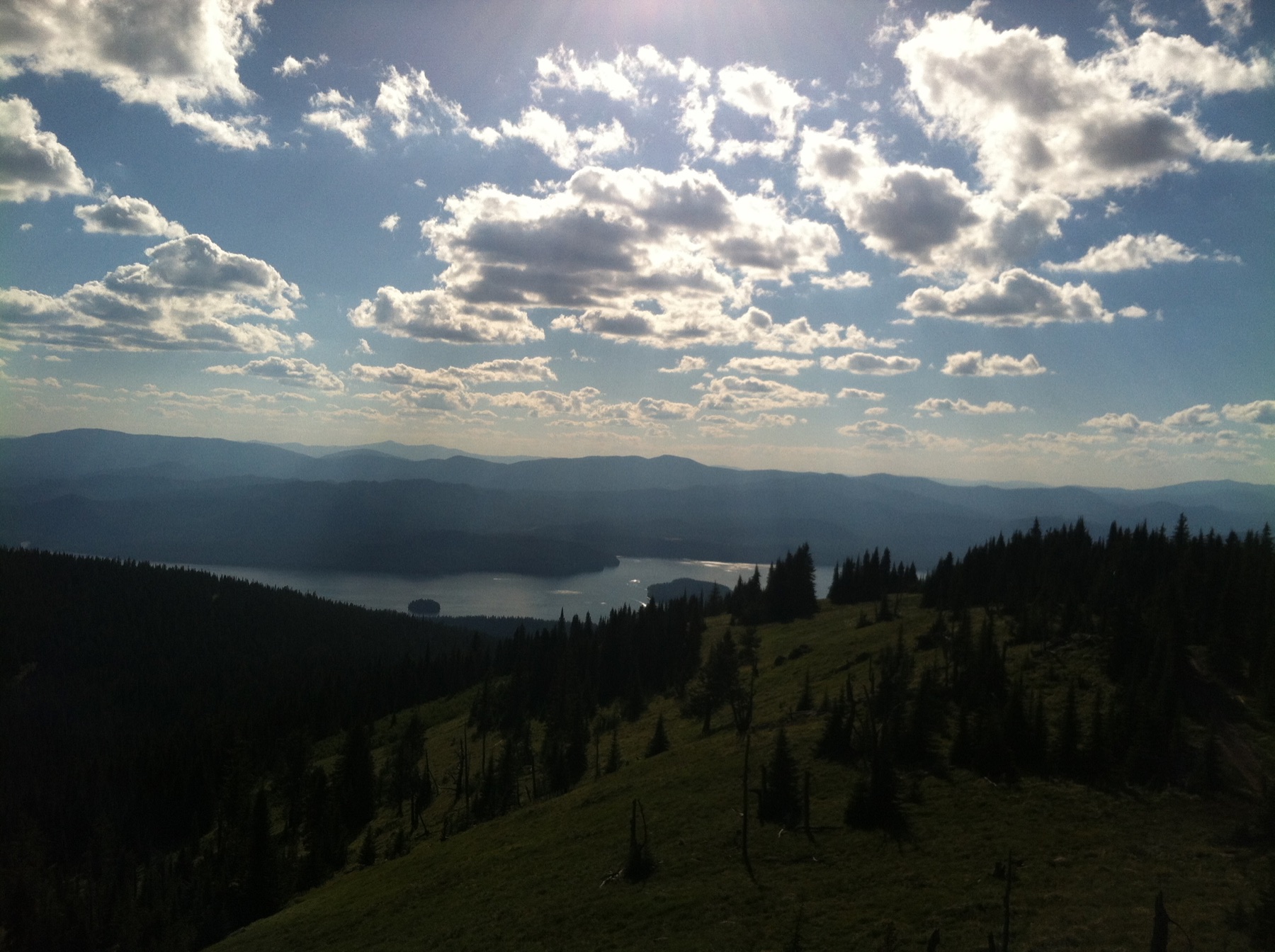 Mountain and lake terrain representing Northwest spraying service conditions